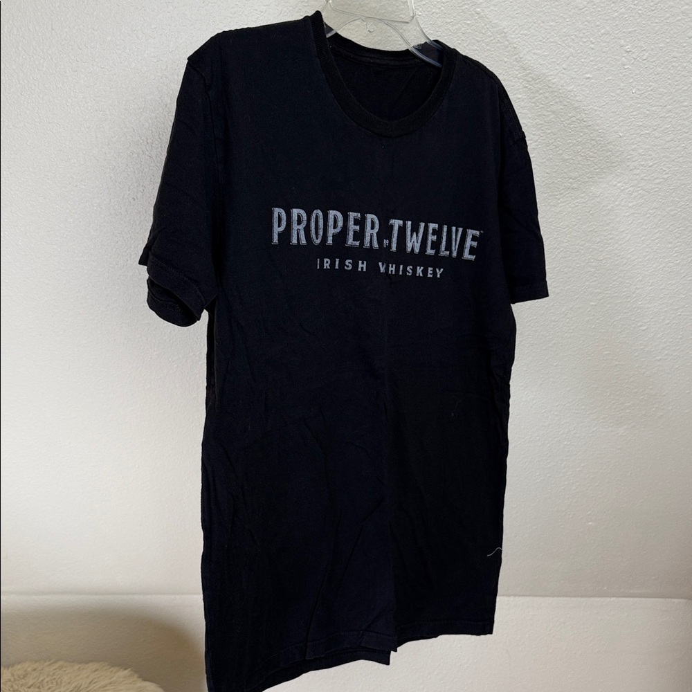 PROPER NO. TWELVE Irish Whiskey black shirt sleeve tee w/ silver logo.
